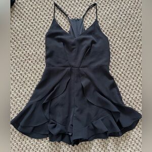 Impeccable Pig black romper with ruffles and adjustable straps